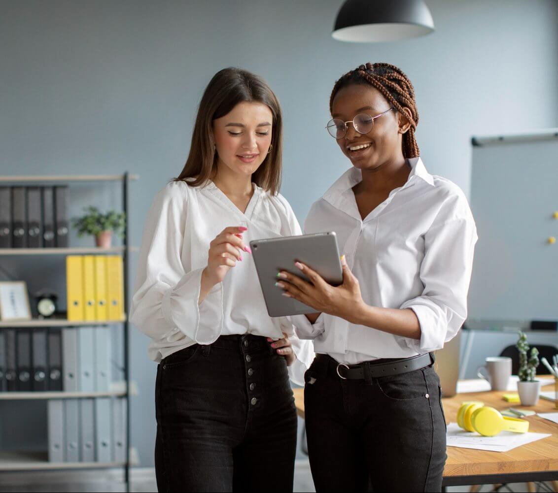 Women working together on tablet reading about GDPR